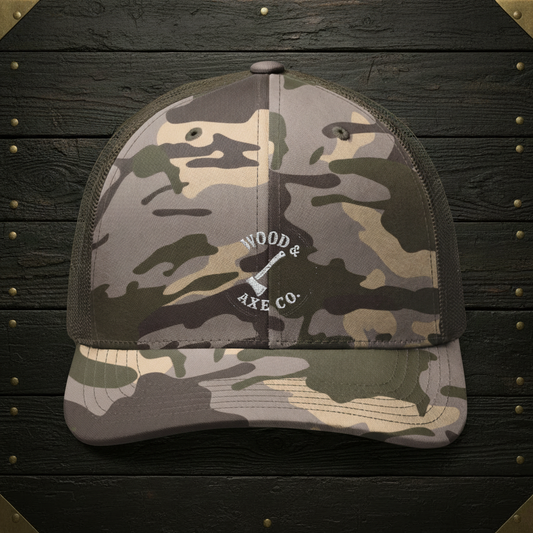 Camo Trucker Hat on Wood Background